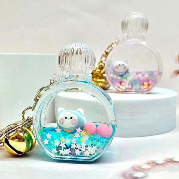 PERFUME BOTTLE ANIMAL FLOATY KEYCHAIN